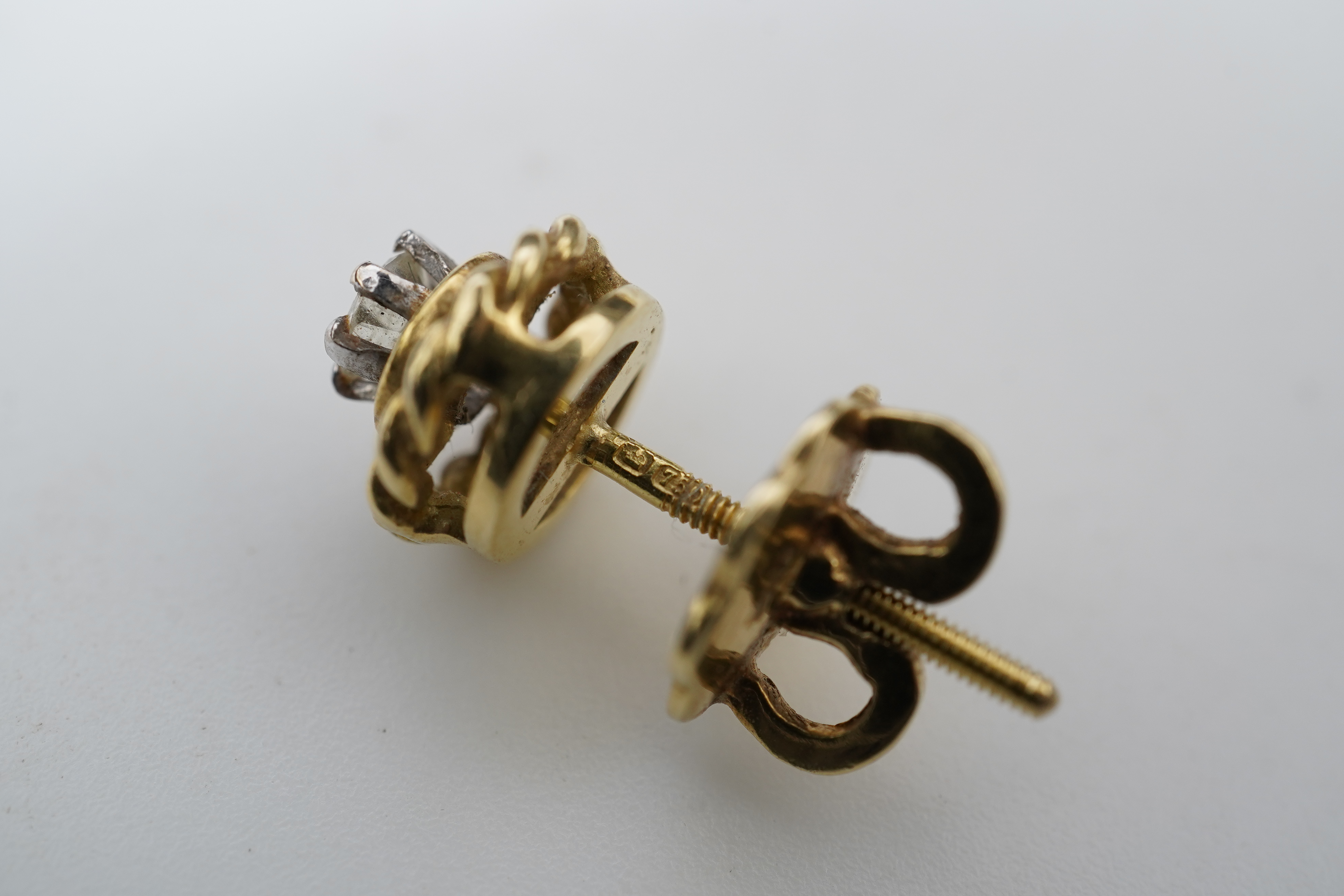 A pair of diamond stud earrings